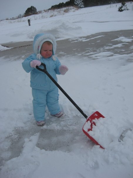 Adelyn shoveling snow